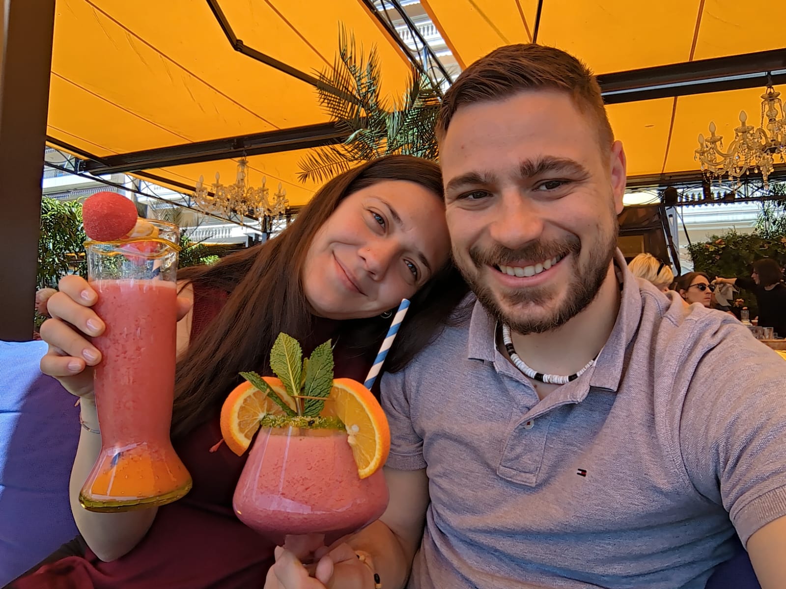 four guys behind a raclette oven